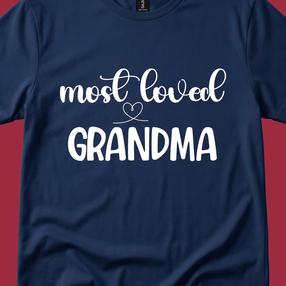 Most loved grandma typography design with a heart graphic.