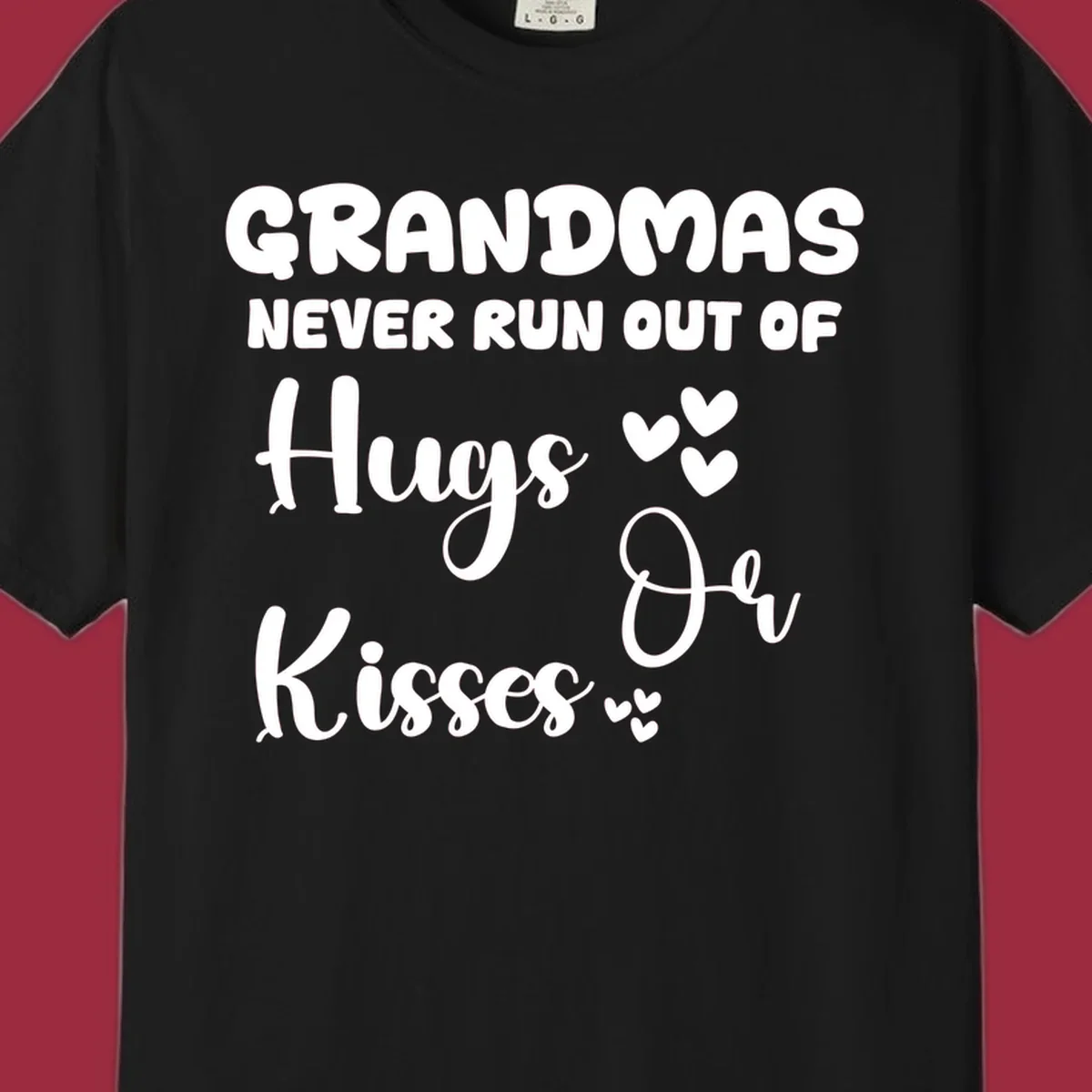 Grandma hugs and kisses typography design with heart accents.