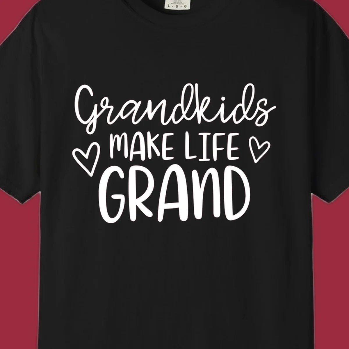 Grandkids Make Life Grand text with hearts, white on black and white.