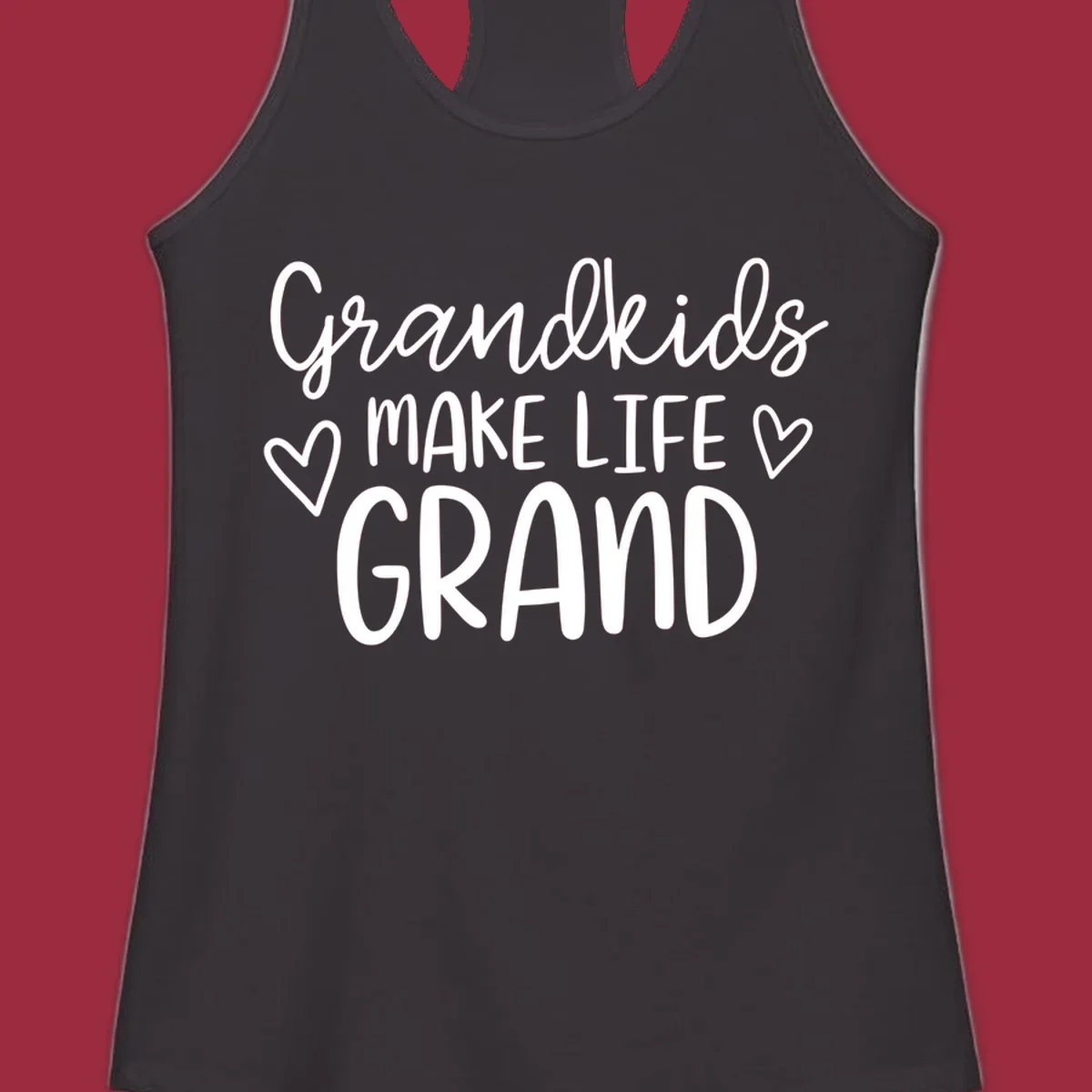 Grandkids Make Life Grand text with hearts, white on black and white.