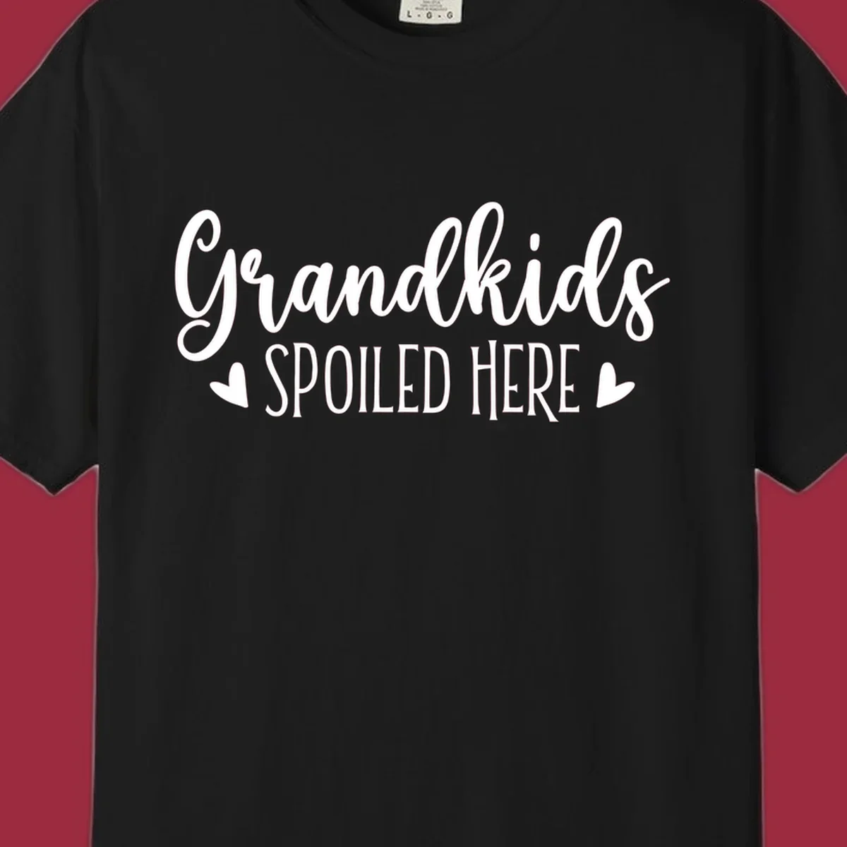 Grandkids Spoiled Here typography design with heart accents.