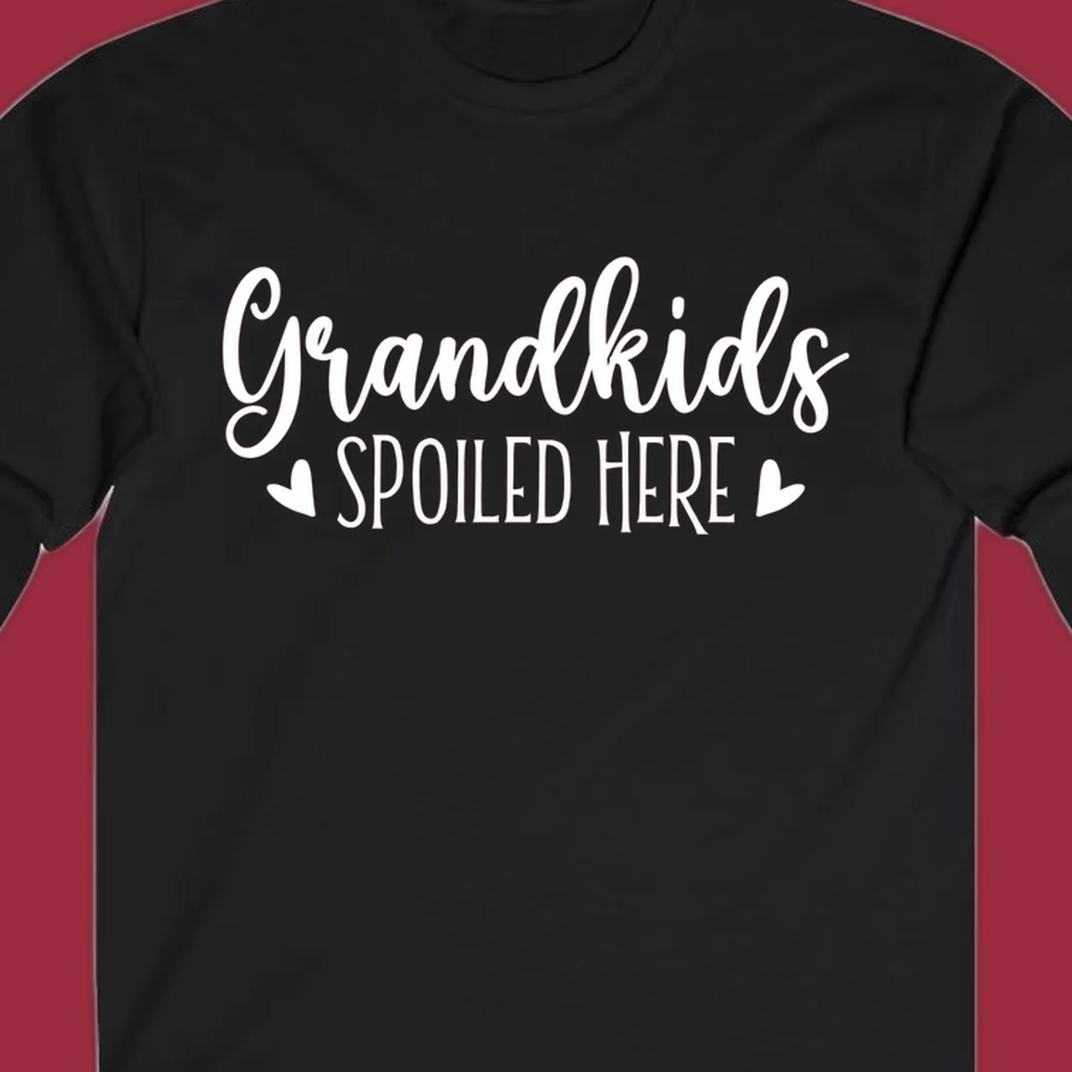 Grandkids Spoiled Here typography design with heart accents.