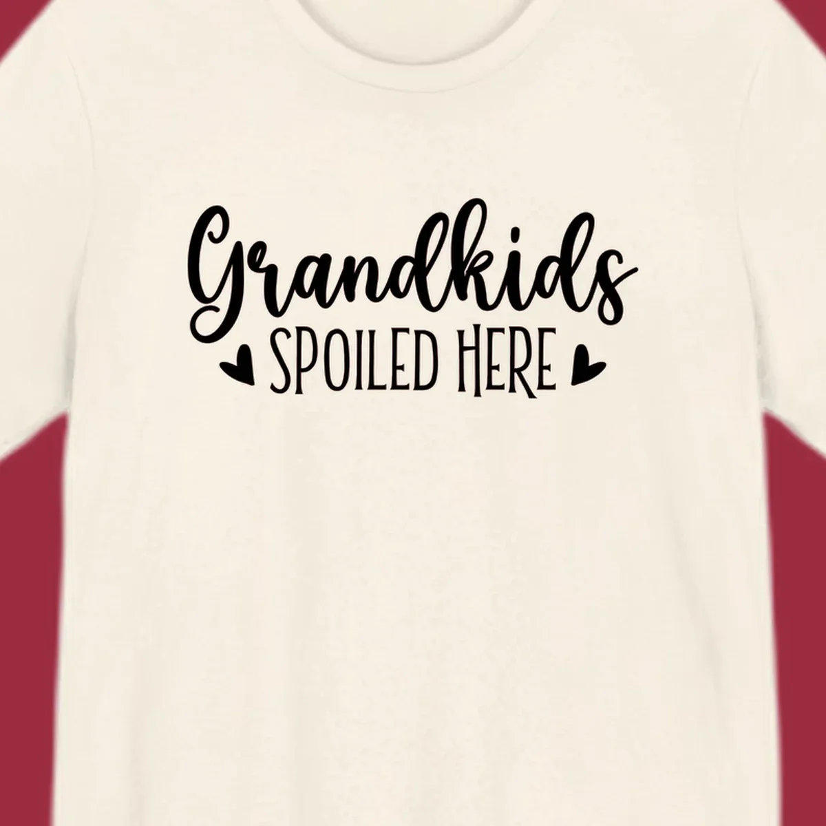 Grandkids Spoiled Here typography design with heart accents.