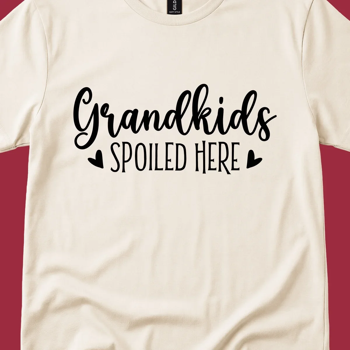 Grandkids Spoiled Here typography design with heart accents.