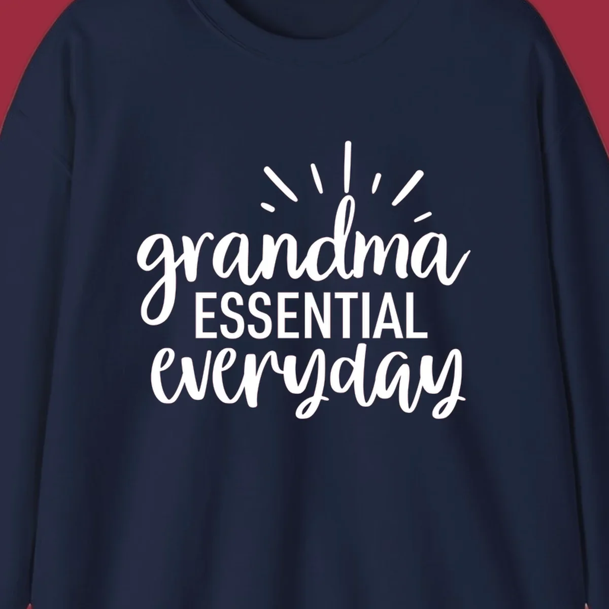 Grandma Essential Everyday text design with sun rays.
