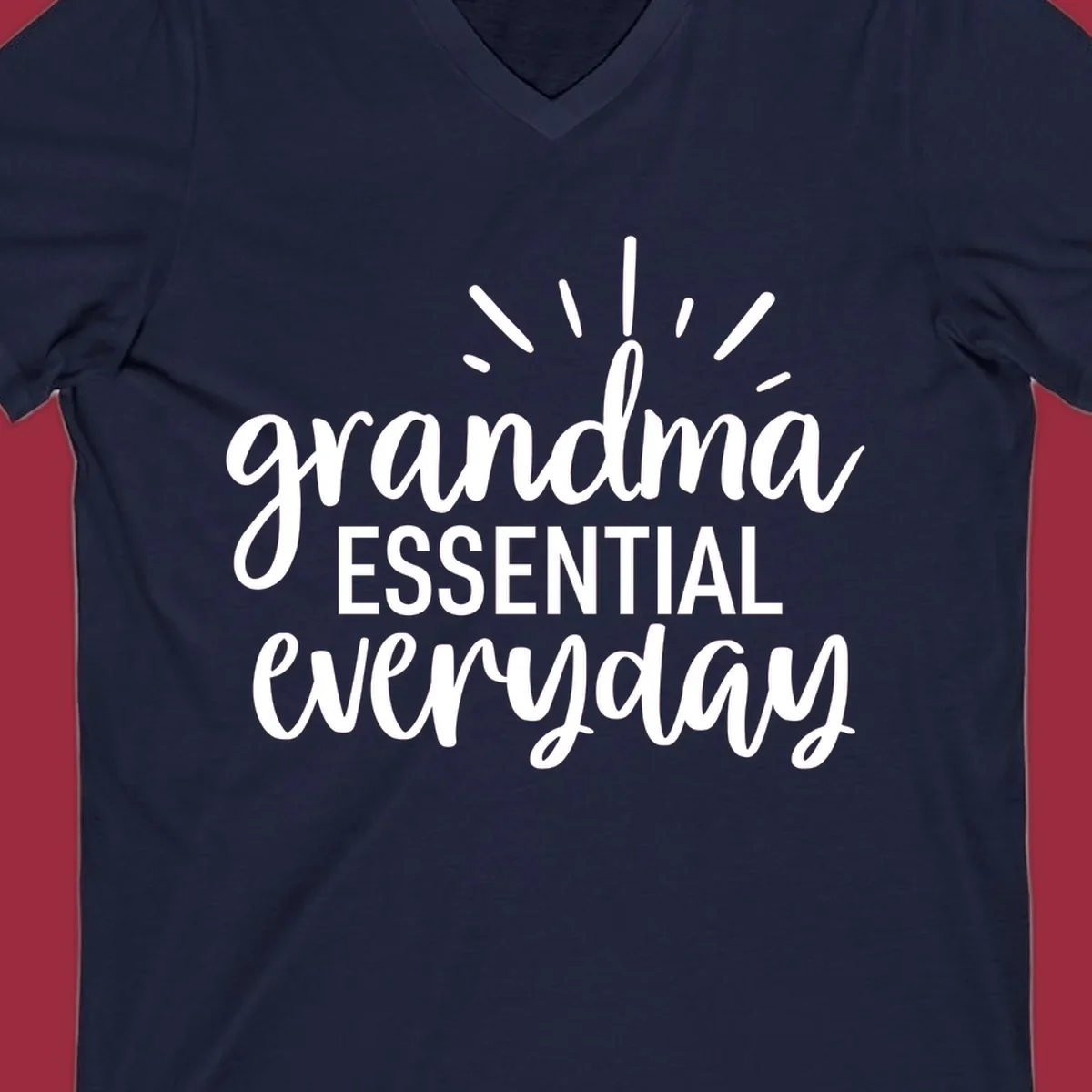 Grandma Essential Everyday text design with sun rays.