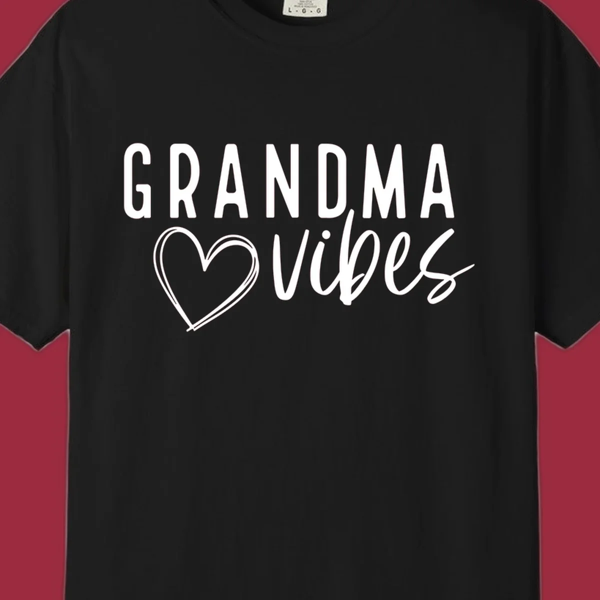 Grandma vibes text with a heart outline, white on black and black on white.