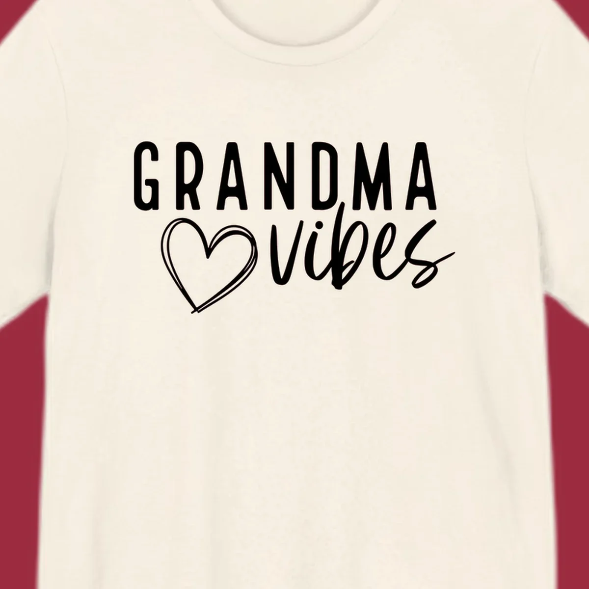 Grandma vibes text with a heart outline, white on black and black on white.