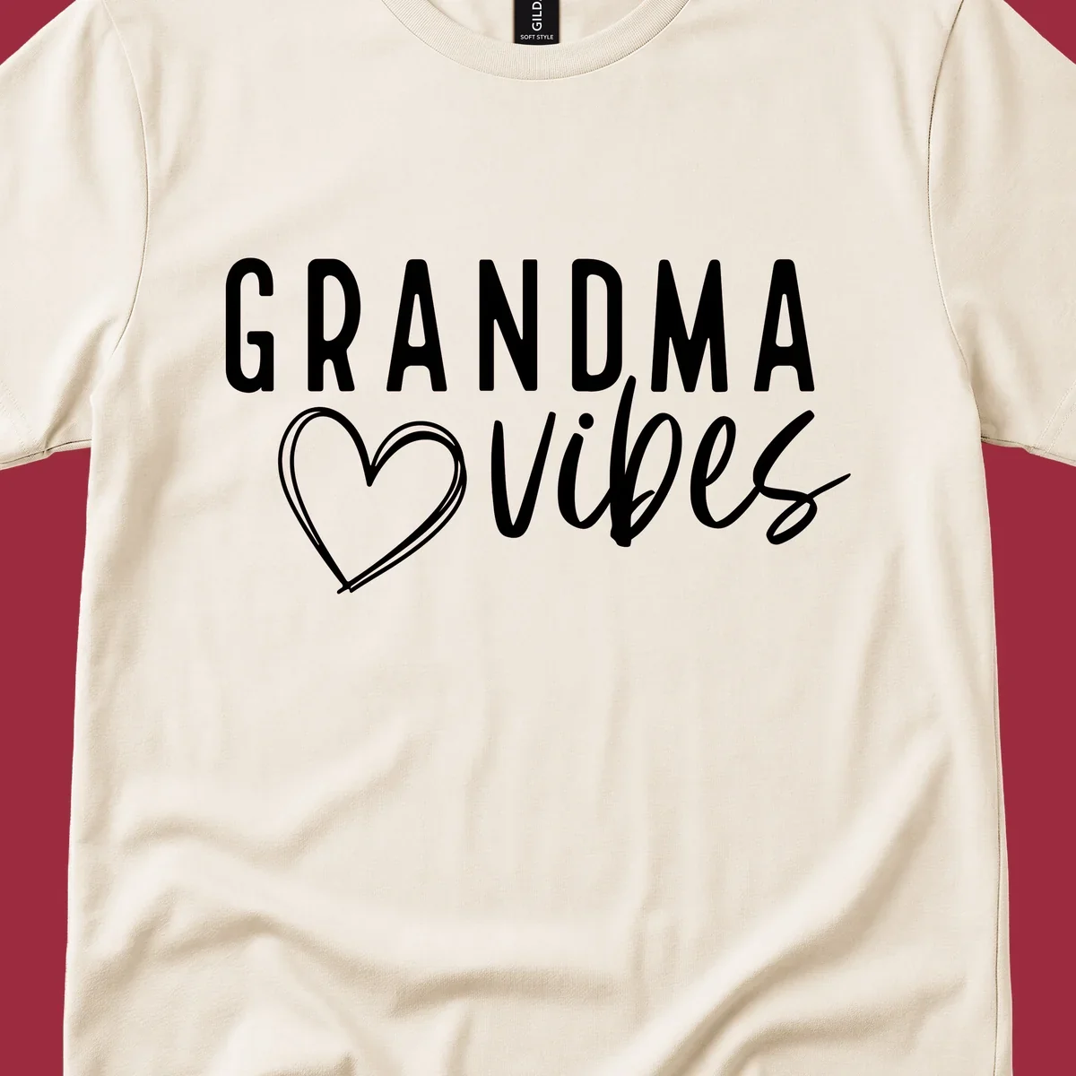 Grandma vibes text with a heart outline, white on black and black on white.