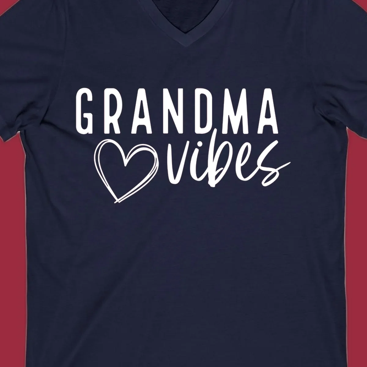 Grandma vibes text with a heart outline, white on black and black on white.