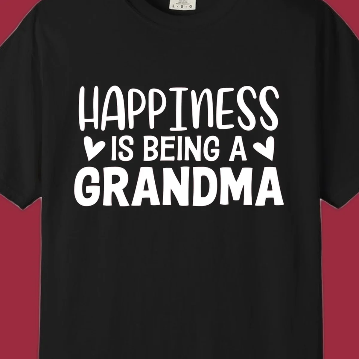Happiness is being a grandma quote with hearts graphic.