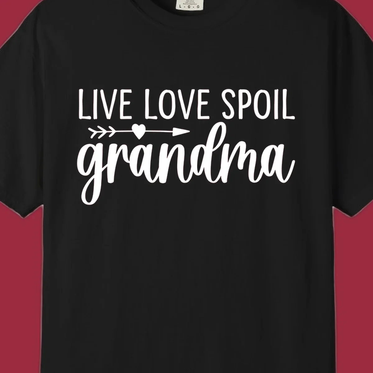 Live Love Spoil Grandma typography design with heart and arrow.