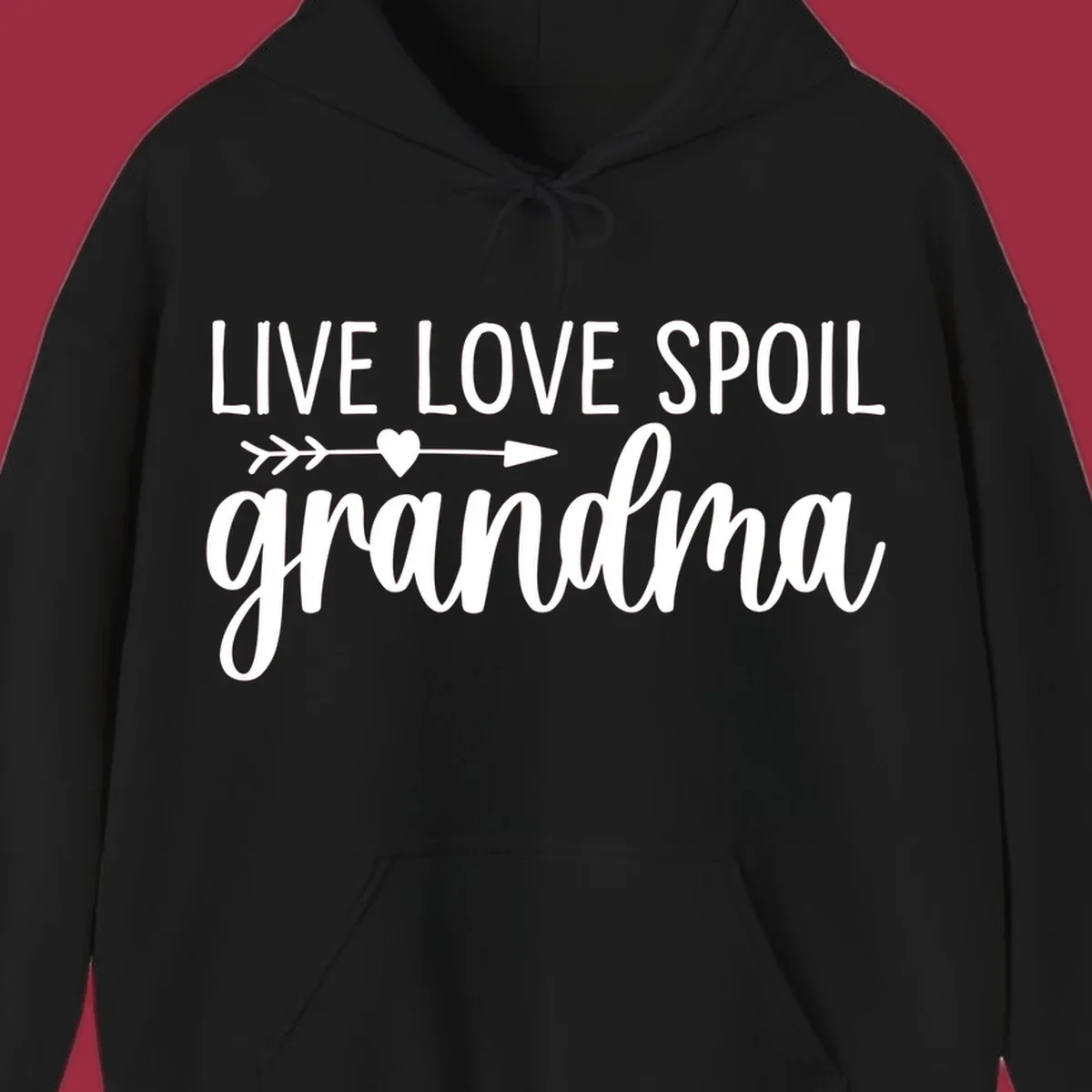 Live Love Spoil Grandma typography design with heart and arrow.