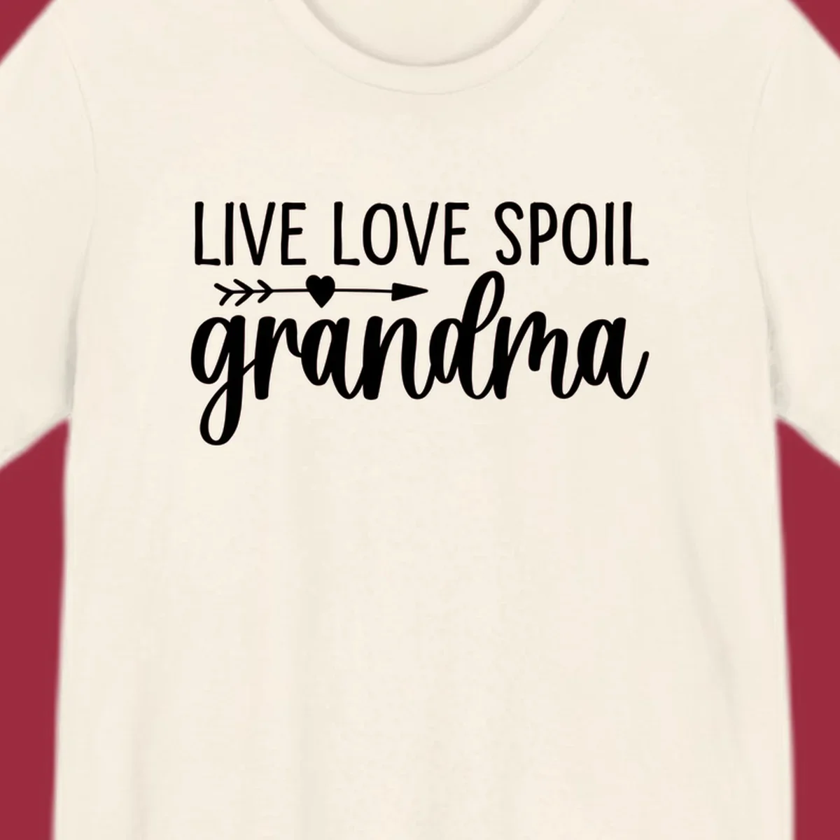 Live Love Spoil Grandma typography design with heart and arrow.