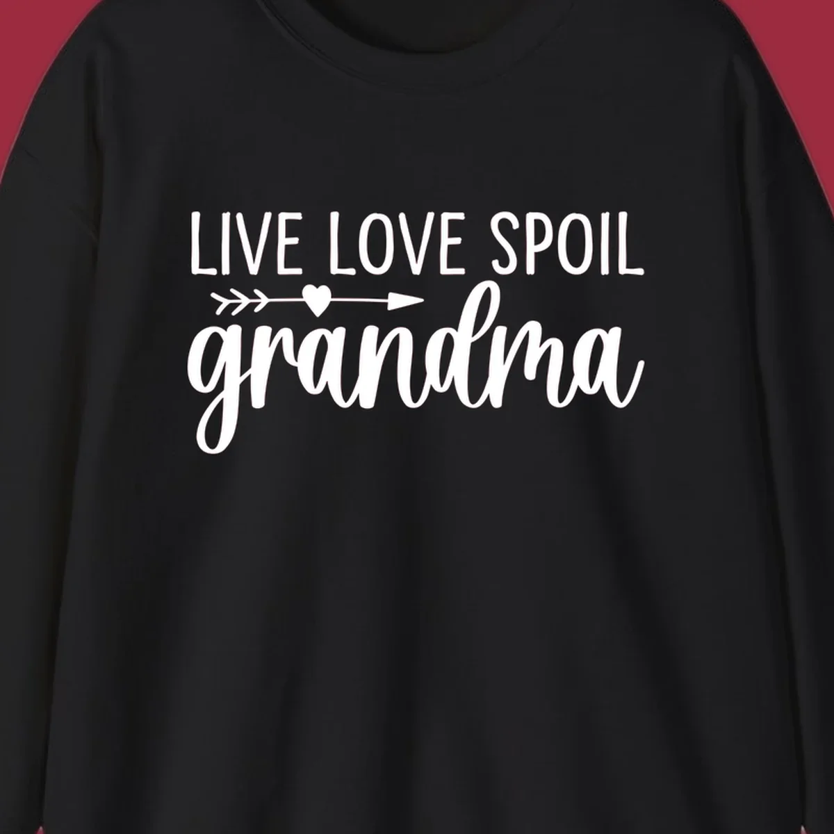 Live Love Spoil Grandma typography design with heart and arrow.