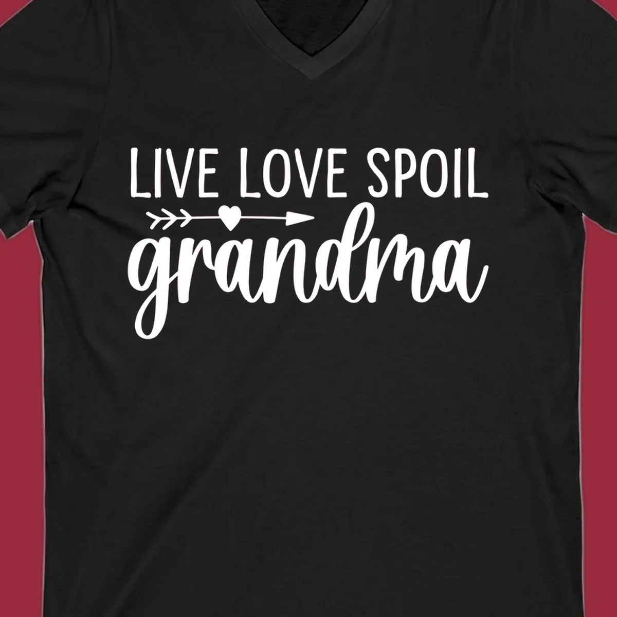 Live Love Spoil Grandma typography design with heart and arrow.