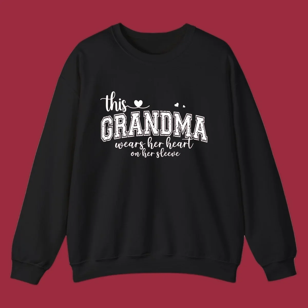 This Grandma Wears Her Heart On Her Sleeve text design with hearts.