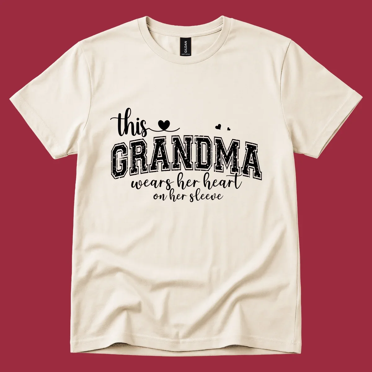 This Grandma Wears Her Heart On Her Sleeve text design with hearts.