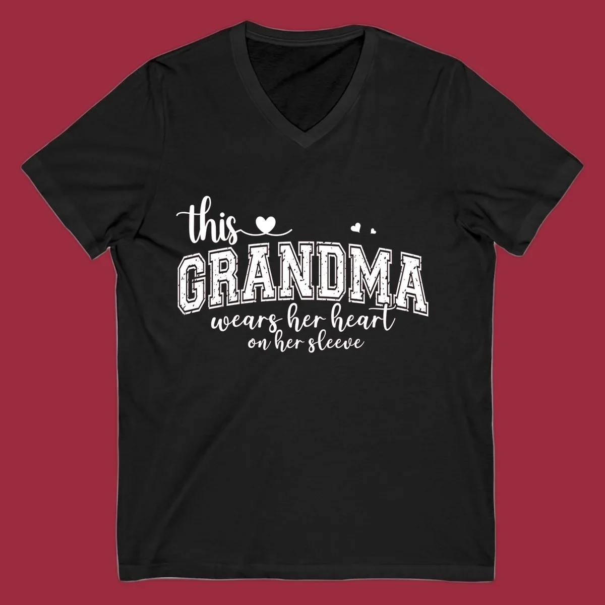 This Grandma Wears Her Heart On Her Sleeve text design with hearts.