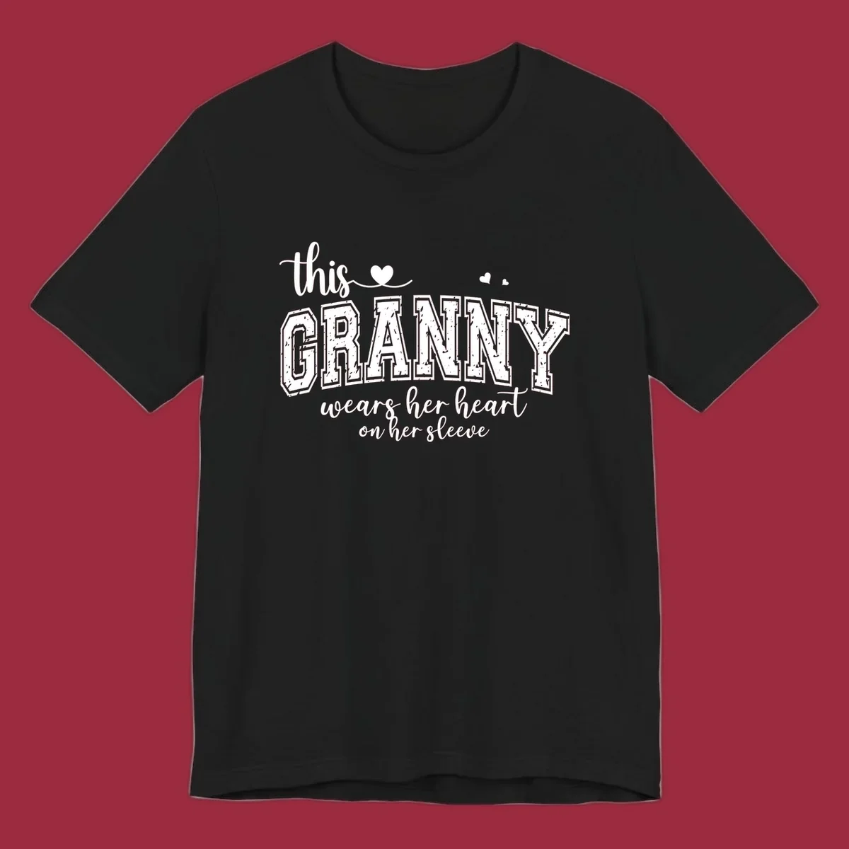 This Granny Wears Her Heart On Her Sleeve text design with heart graphics.