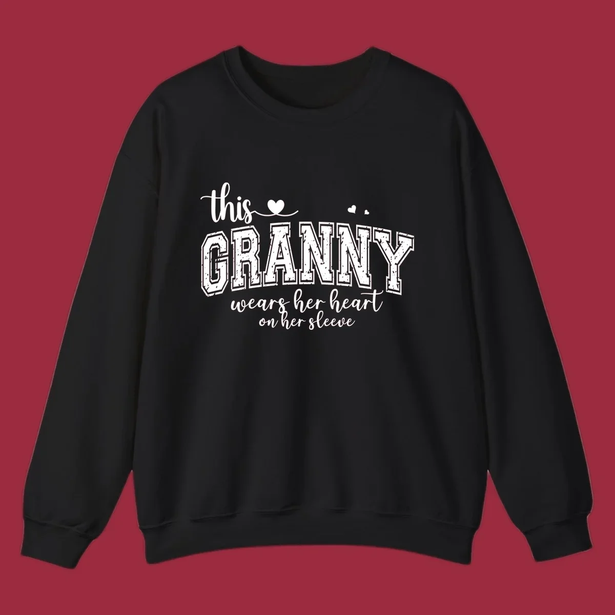 This Granny Wears Her Heart On Her Sleeve text design with heart graphics.