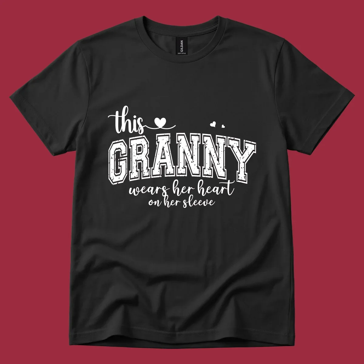 This Granny Wears Her Heart On Her Sleeve text design with heart graphics.