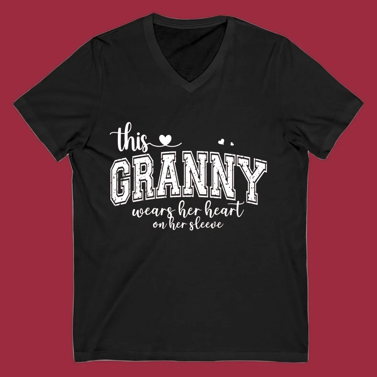 This Granny Wears Her Heart On Her Sleeve text design with heart graphics.