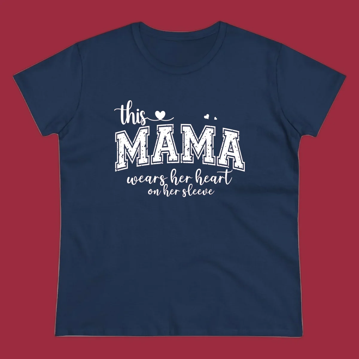 Mama heart on sleeve typography design with script and distressed block text and heart accents.