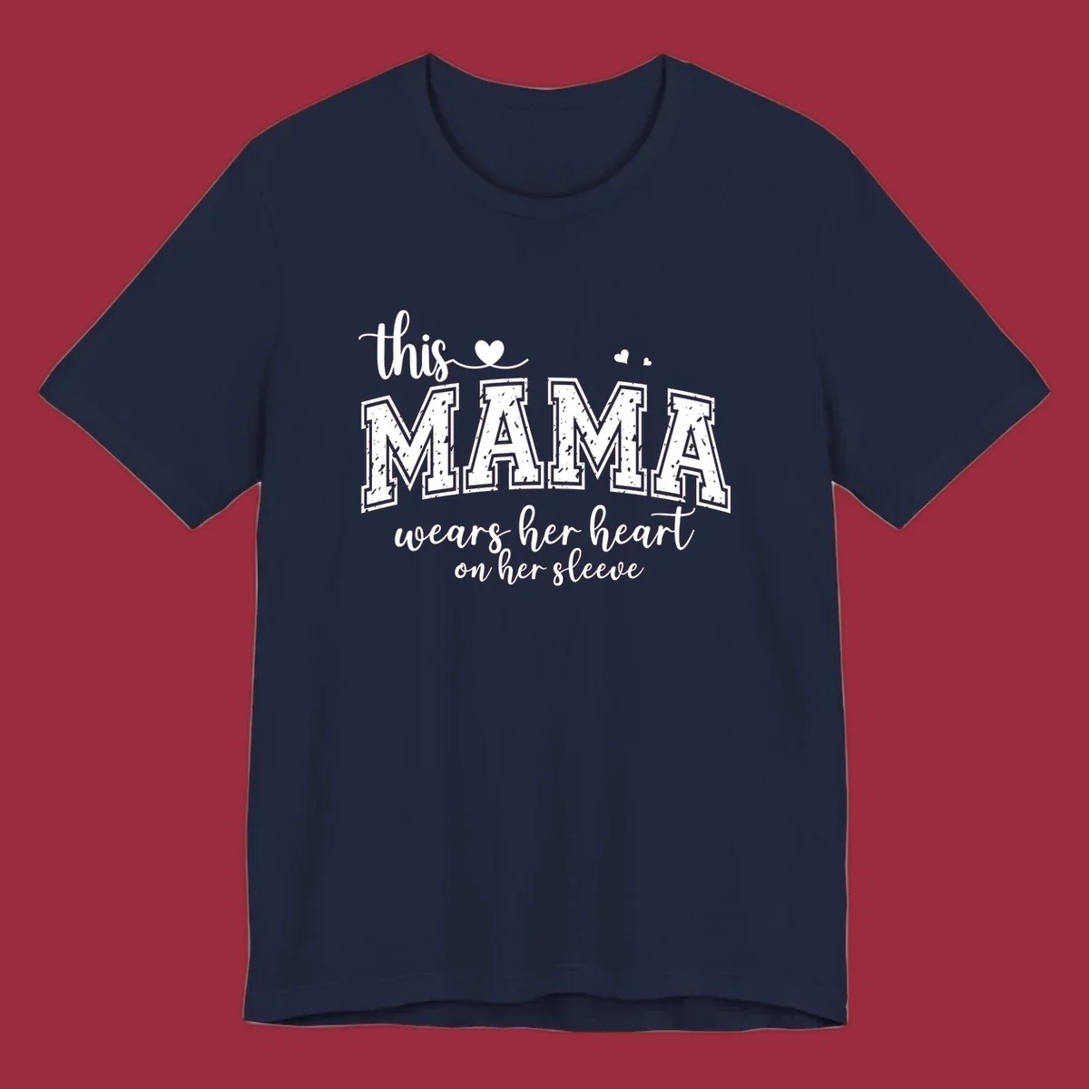 Mama heart on sleeve typography design with script and distressed block text and heart accents.
