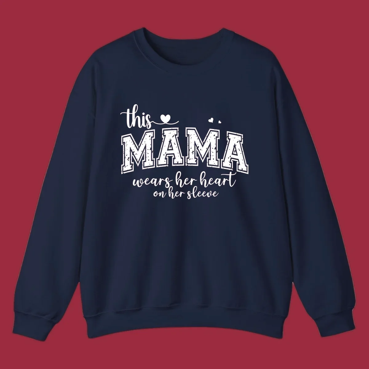 Mama heart on sleeve typography design with script and distressed block text and heart accents.