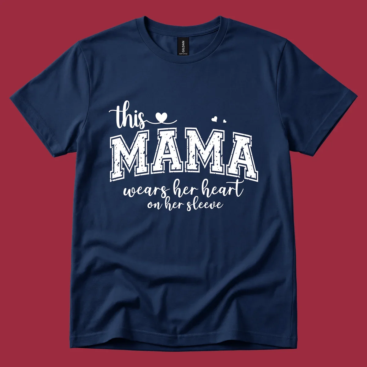 Mama heart on sleeve typography design with script and distressed block text and heart accents.