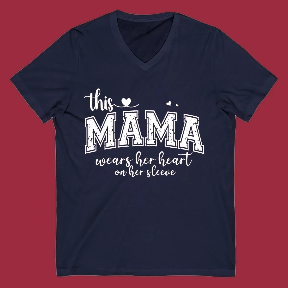 Mama heart on sleeve typography design with script and distressed block text and heart accents.