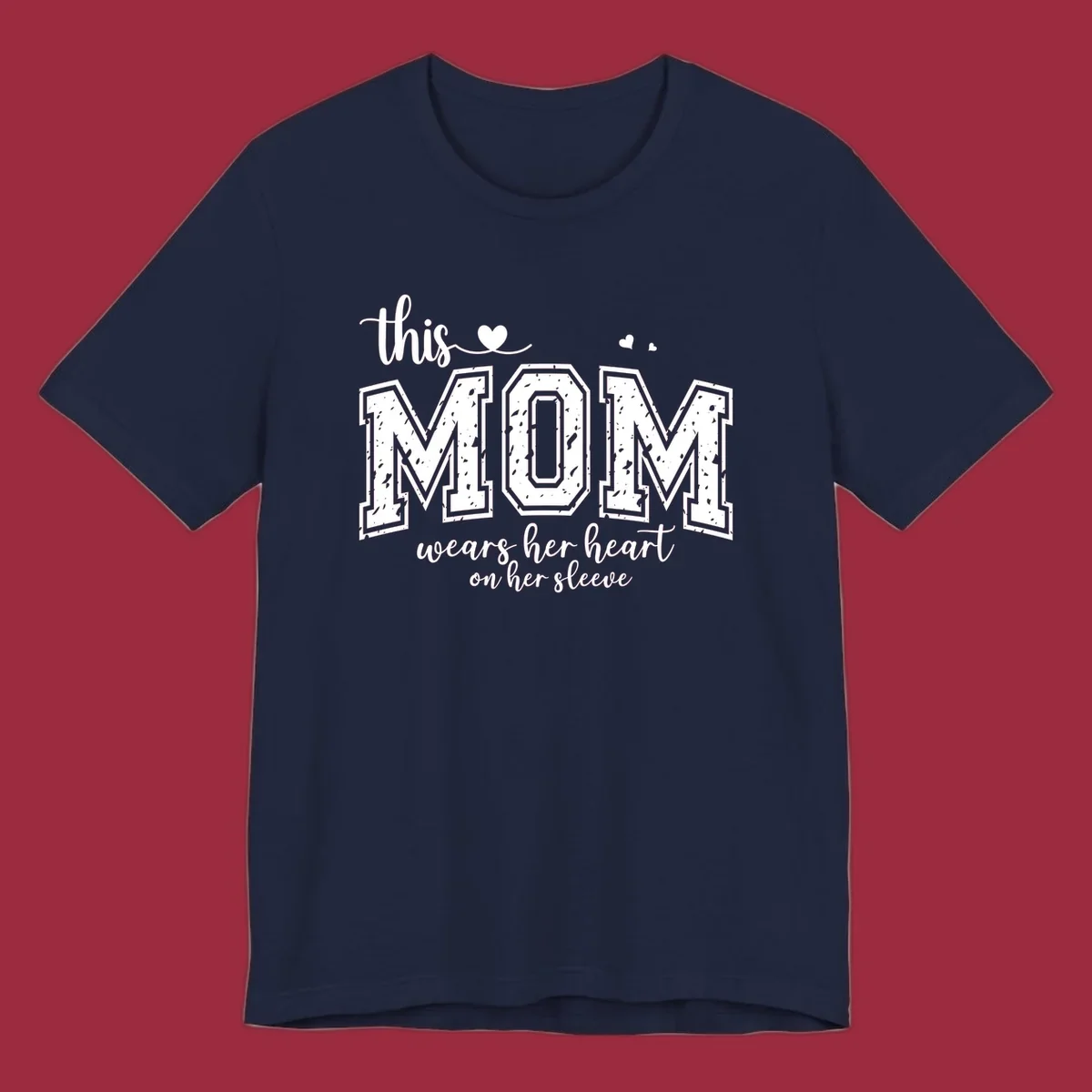 This mom wears her heart on her sleeve graphic with distressed text and heart icons.