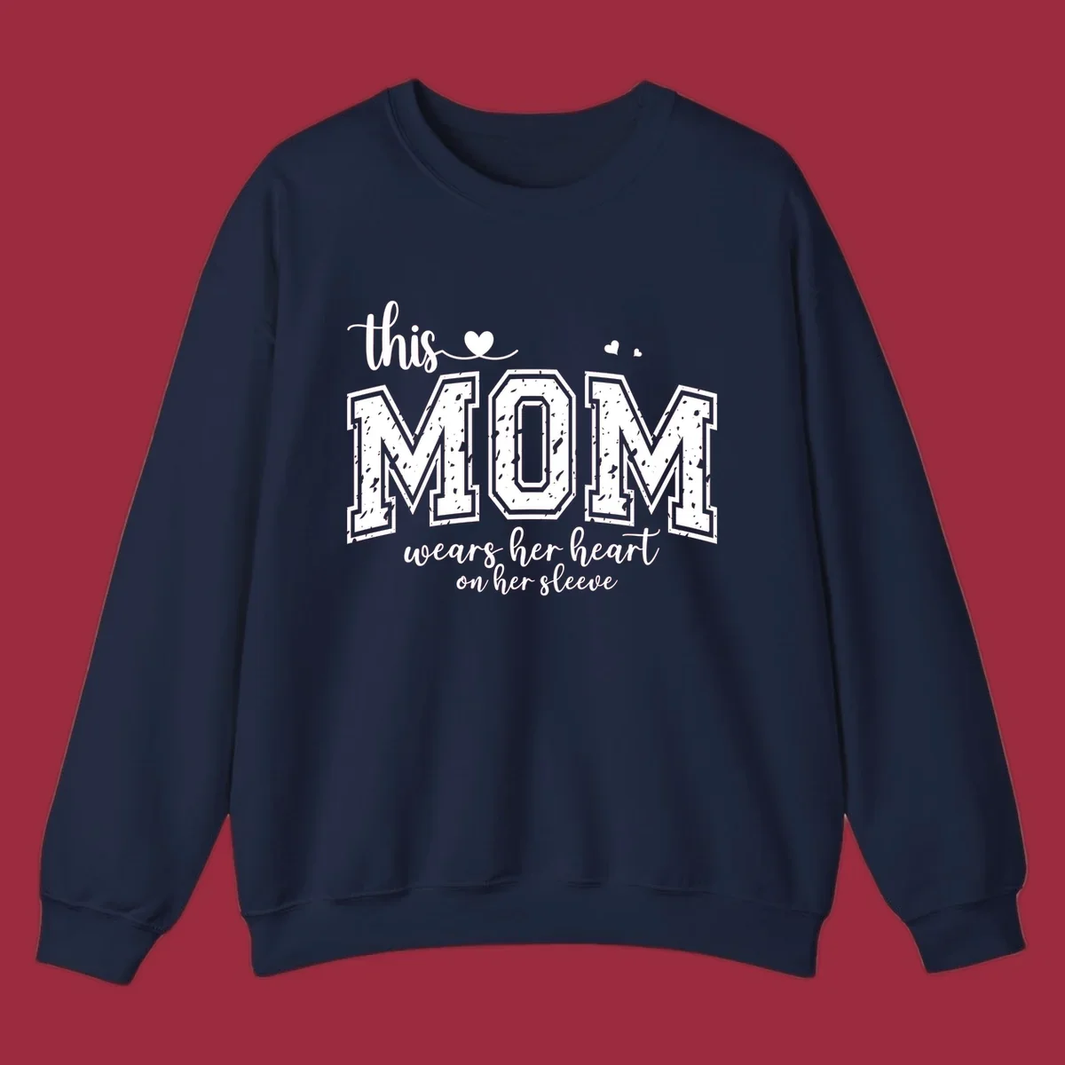 This mom wears her heart on her sleeve graphic with distressed text and heart icons.