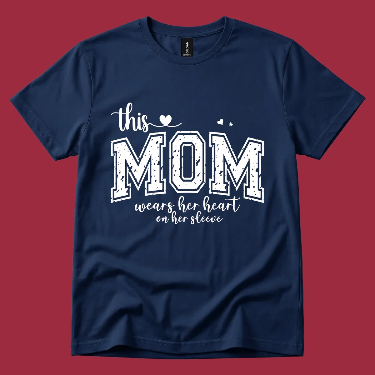 This mom wears her heart on her sleeve graphic with distressed text and heart icons.