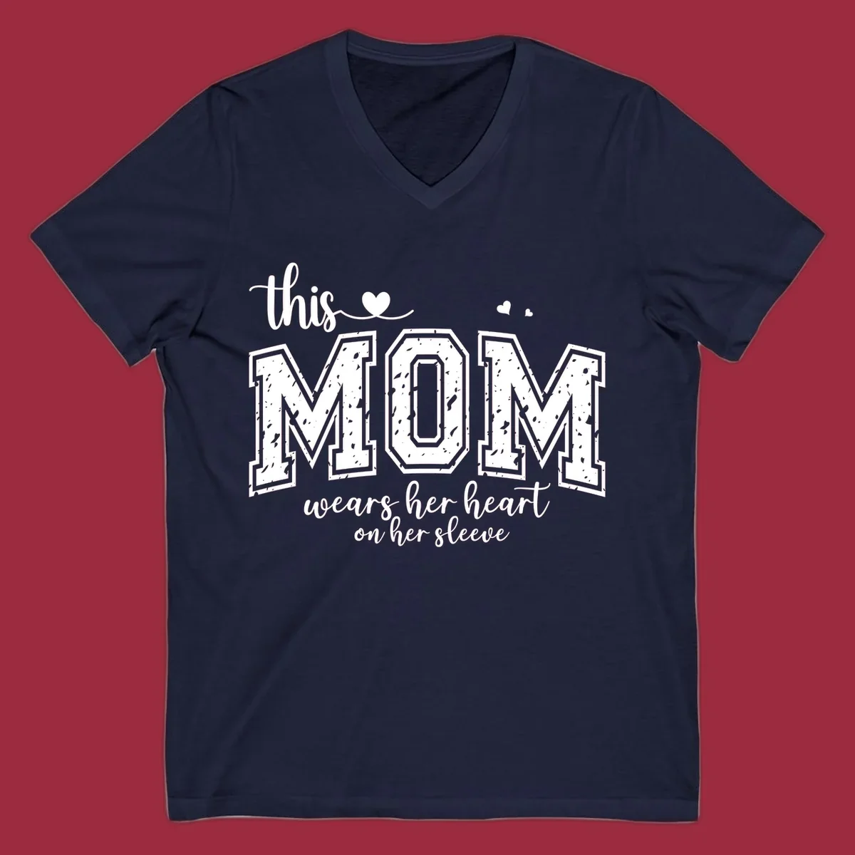 This mom wears her heart on her sleeve graphic with distressed text and heart icons.
