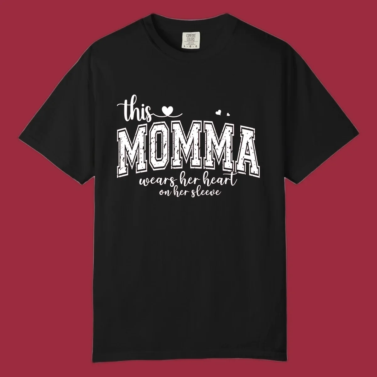Momma heart on sleeve typography design with script and varsity text and heart icons.