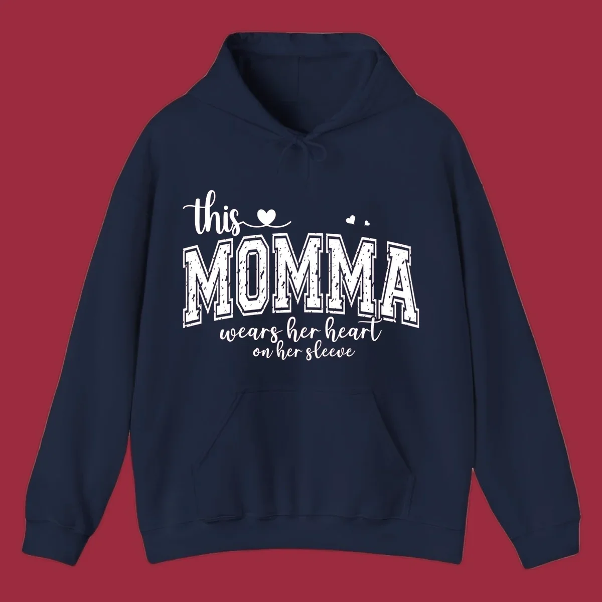 Momma heart on sleeve typography design with script and varsity text and heart icons.