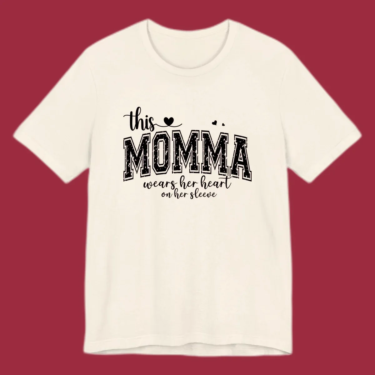 Momma heart on sleeve typography design with script and varsity text and heart icons.