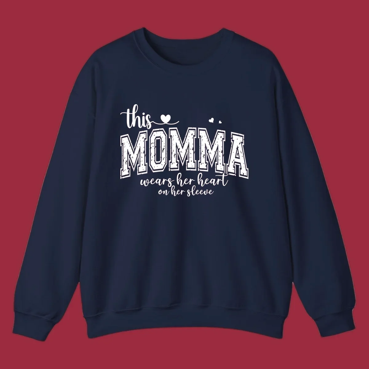 Momma heart on sleeve typography design with script and varsity text and heart icons.