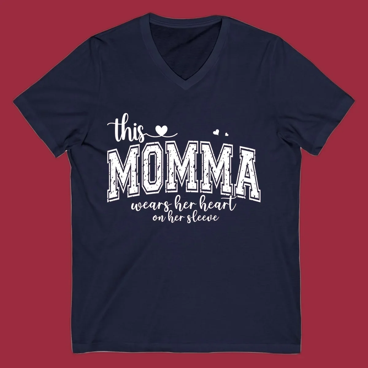 Momma heart on sleeve typography design with script and varsity text and heart icons.