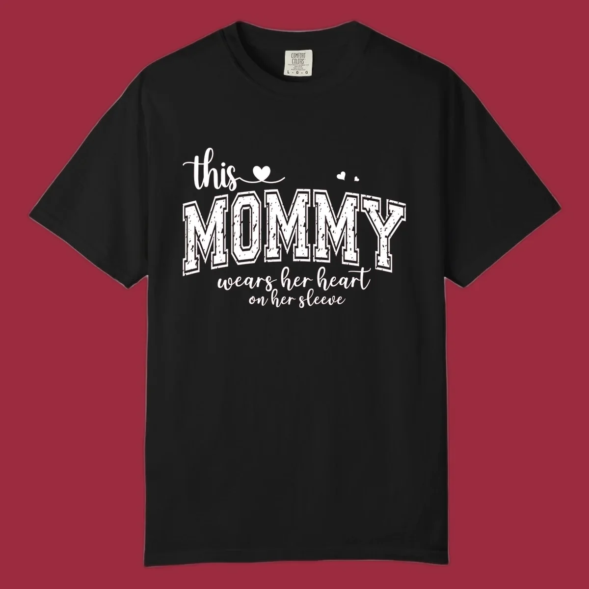 This Mommy Wears Her Heart On Her Sleeve text design with hearts.