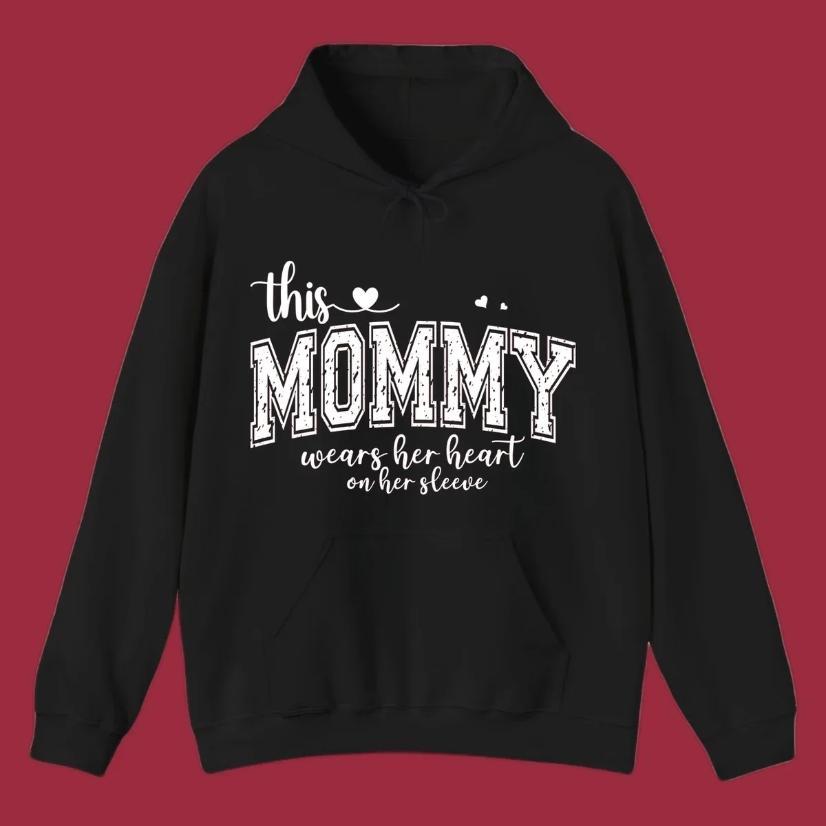 This Mommy Wears Her Heart On Her Sleeve text design with hearts.