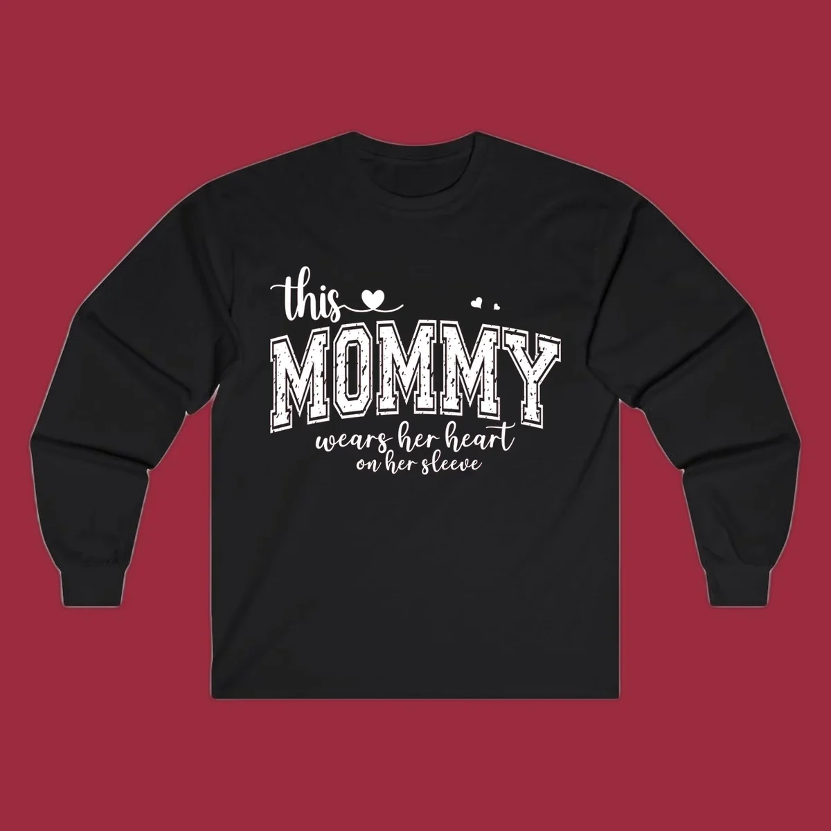 This Mommy Wears Her Heart On Her Sleeve text design with hearts.