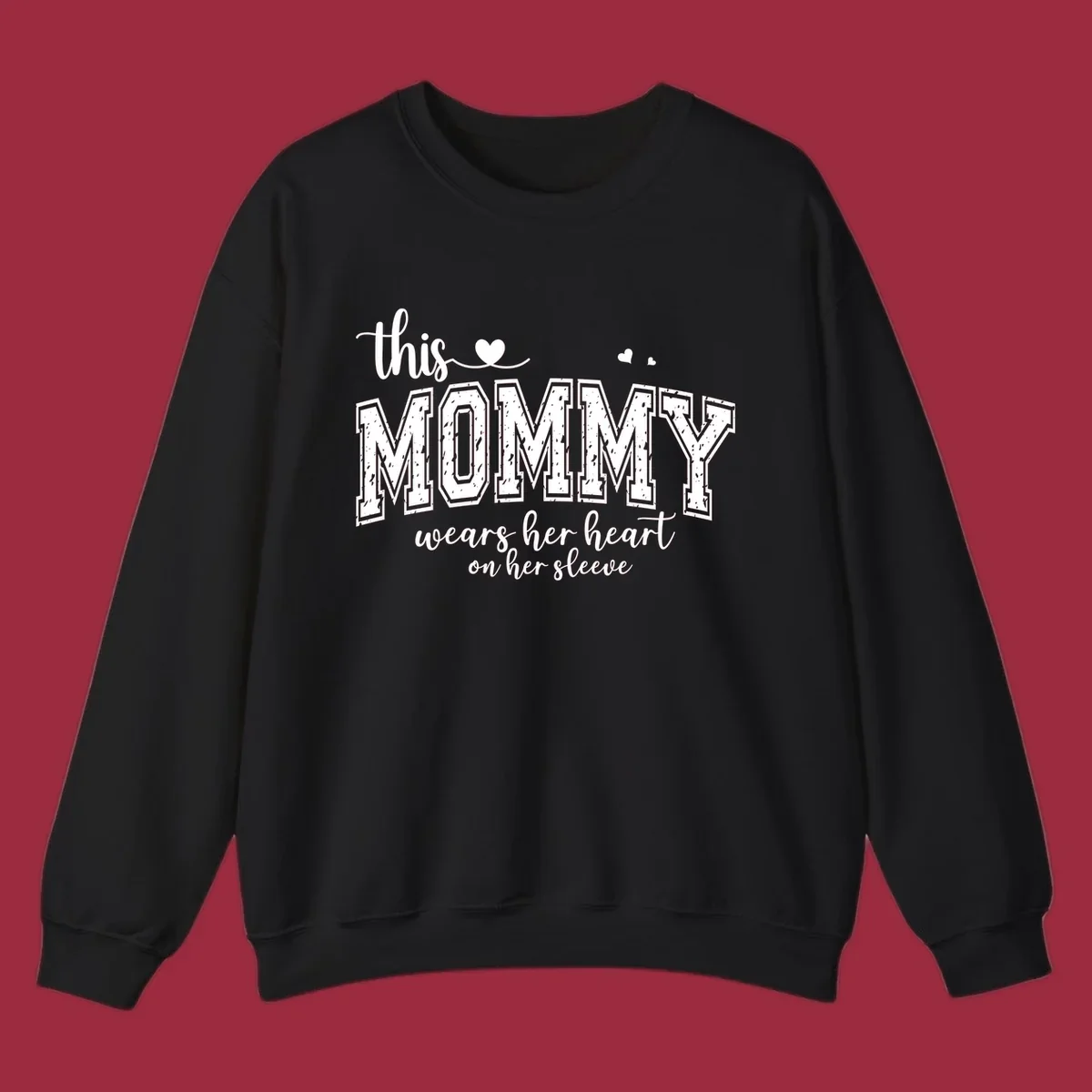 This Mommy Wears Her Heart On Her Sleeve text design with hearts.