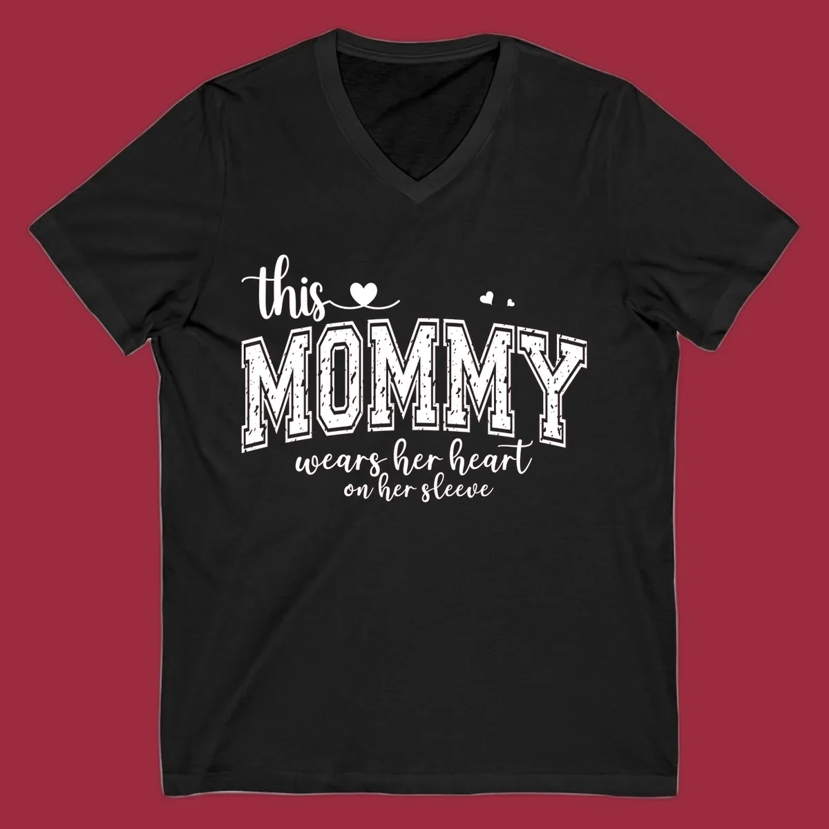 This Mommy Wears Her Heart On Her Sleeve text design with hearts.