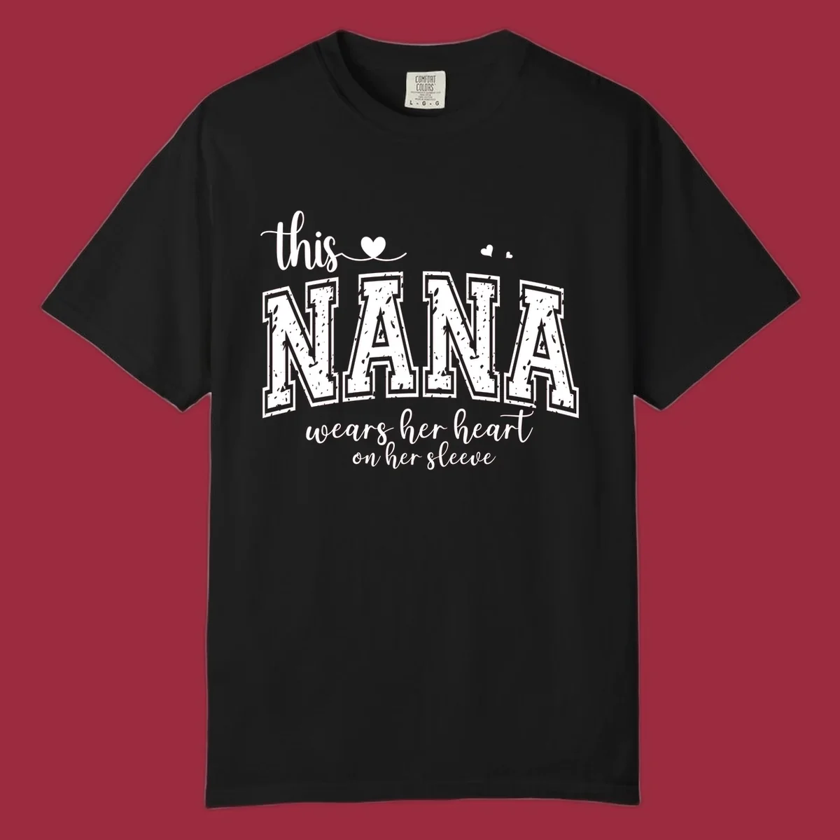 Text design for Nana that says 'this nana wears her heart on her sleeve' with heart accents.
