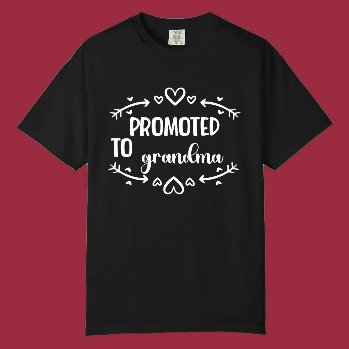 Promoted to Grandma text with hearts and arrows graphic.