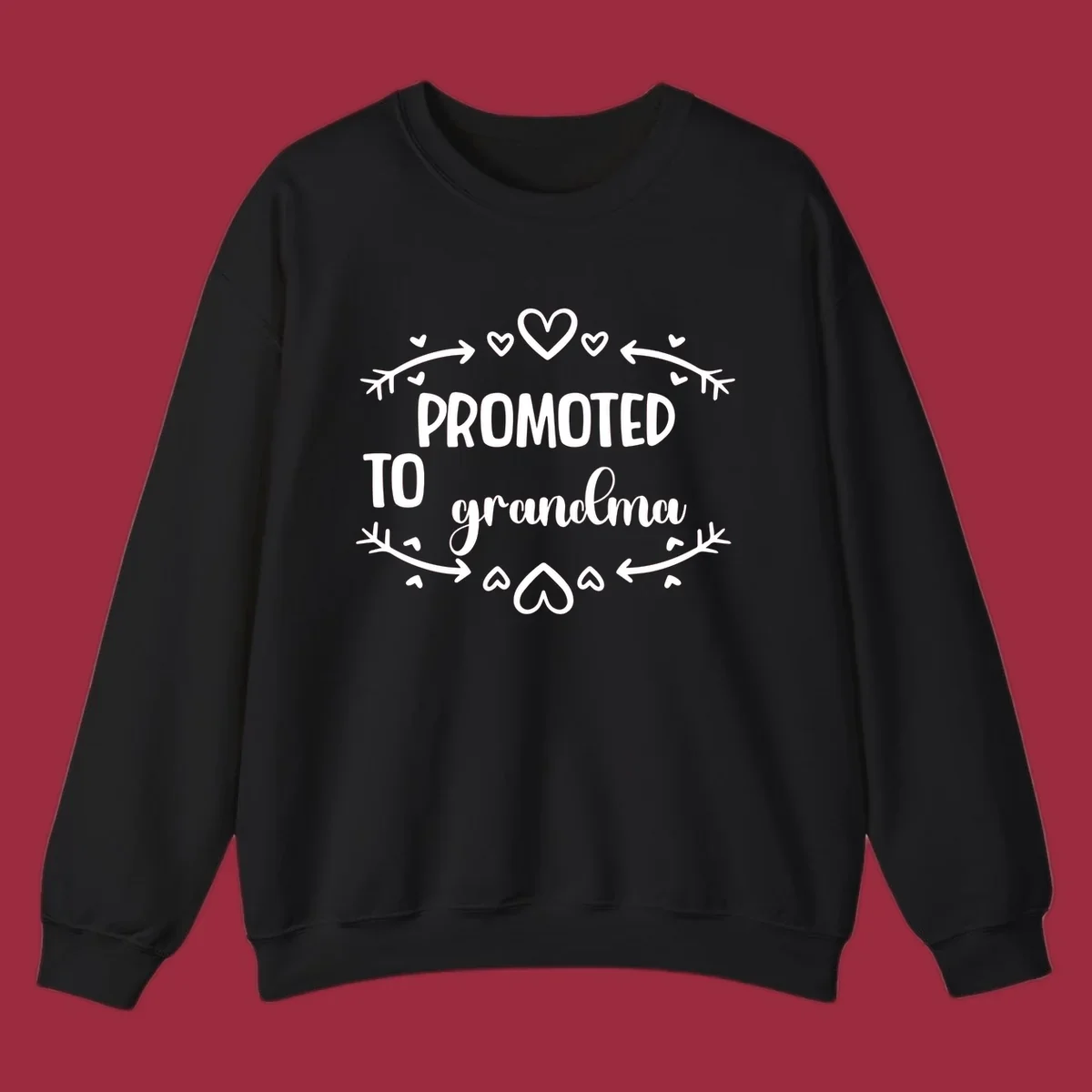 Promoted to Grandma text with hearts and arrows graphic.