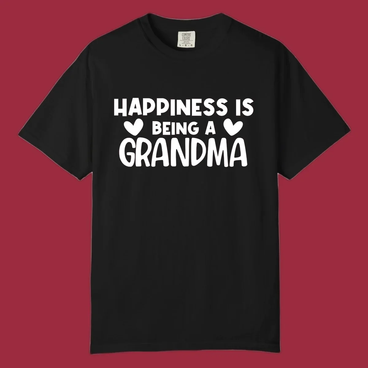 Happiness is being a grandma quote with heart graphics.